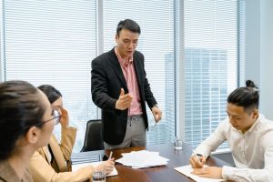 Men and women around a desk