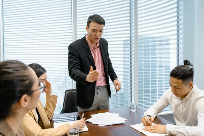 Men and women around a desk